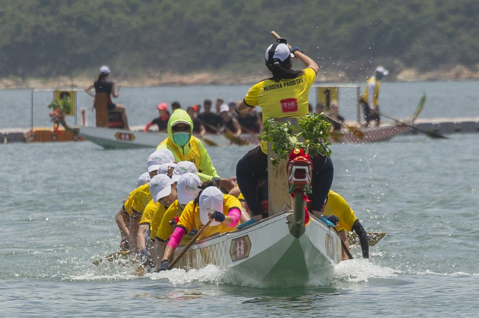The Merdeka Paddlers racing their dragon boat at Stanley