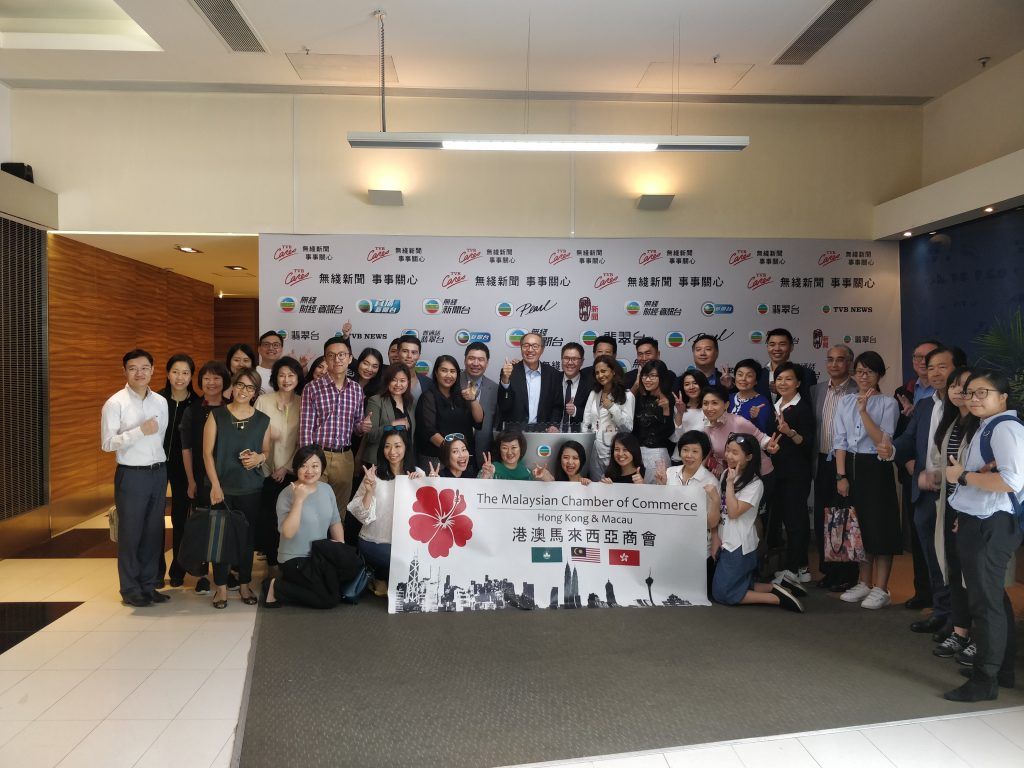 Members with the MAYCHAM banner on the TVB Studio Tour